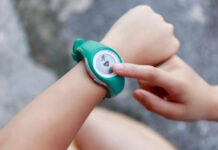 Overestimating Fitness Levels: The Hidden Saboteur Person using a fitness tracker on their wrist