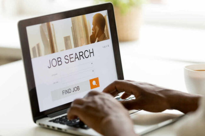 shutterstock_1044298738.jpg Person using a laptop for job searching