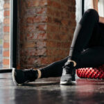 Game-Changing Leg Exercise Ignored by Most Person using a foam roller for stretching in a fitness studio