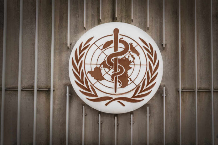 shutterstock_1691653948.jpg World Health Organization emblem featuring a globe and caduceus
