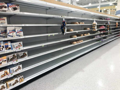 shutterstock_1790285669.jpg Empty grocery store shelves with a few snack items remaining