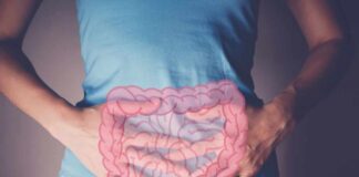 Person holding their stomach with a graphic of intestines overlayed