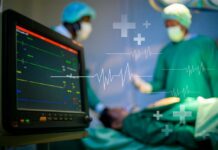 Medical professionals in an operating room monitoring a patient