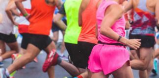 Runners participating in a marathon, wearing colorful athletic gear