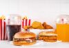 A variety of fast food items including burgers, fries, and drinks