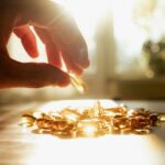 Boswellia Triumphs Over Popular Pain Relief Supplement A hand reaching for a golden capsule among many on a table