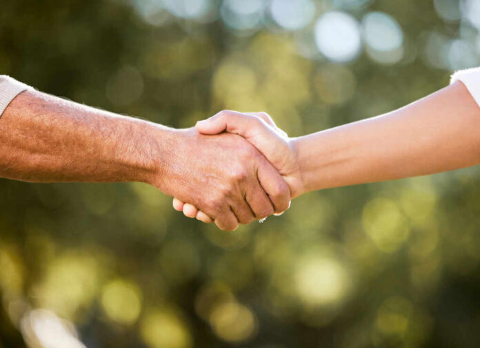 Two hands shaking in a gesture of agreement