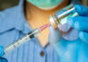 Pediatric Sedation: The Unseen Dangers Healthcare professional preparing a syringe from a vial