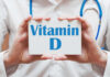 How Vitamin D Could Upend IBD Treatments Medical professional holding a card that says 'Vitamin D'