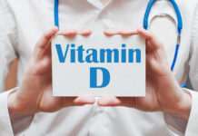 How Vitamin D Could Upend IBD Treatments Medical professional holding a card that says 'Vitamin D'