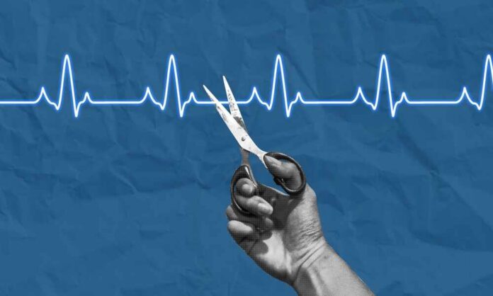 Ending,Life,Concept,Collage,Art.,Hand,With,Scissors,Cutting,An A hand holding scissors above a heartbeat line on a blue background