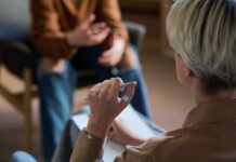 Life on Autopilot: How To Reconnect and Rediscover Yourself Two individuals engaged in a conversation during a counseling session