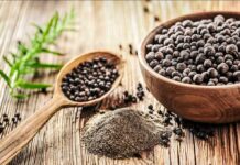 This Grain Could Help Protect Your Brain As You Age Black peppercorns in a wooden bowl and spoon with ground pepper