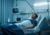 Blind Patients READ Again — Blindness REVERSED! Man lying in a hospital bed with monitors and IV equipment