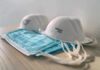 Protective face masks on a wooden table