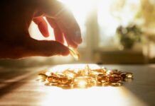 Silent Deficiency, Lifelong Brain Fog A hand reaching for a golden capsule among many on a table