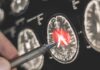 Hidden Brain Gatekeeper Upends Alzheimer’s Playbook A hand pointing at a brain scan with highlighted areas