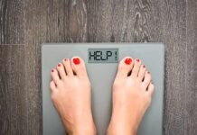 Calories Lie—The Real Obesity Trigger Feet on a digital bathroom scale displaying a help message