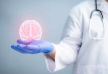Want Better Memory? – Start Here A medical professional holding a glowing digital brain illustration in their hand