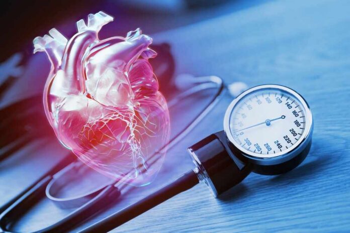 Measurement,Of,Blood,Pressure.,Manual,Medical,Blood,Pressure,Monitor,And An anatomical heart illustration next to a blood pressure monitor