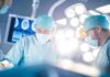 Scientists Discover The Brain Chemical That Helps Break Old Habits Surgeons in operating room under bright surgical lights