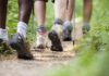 Loneliness Cure? Walks Backfire In Surprise Twist Hikers' feet walking on a forest trail