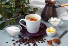 Berries, Cocoa, Coffee: The Recovery Hack Cup of coffee with milk, butter, and spices on a table