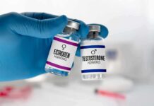 Estrogen Years Tied To Stronger Lungs Gloved hand holding estrogen and testosterone vials