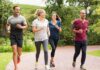 Group of adults jogging together in a park