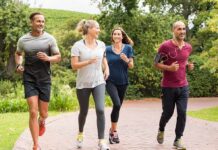 Group of adults jogging together in a park