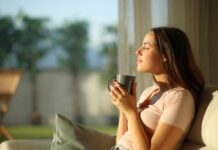 Coffee and Cancer: What New Research Says Woman enjoying a cup of coffee in a sunlit room