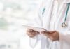 6 Everyday Habits That Increase Cell Inflammation Doctor with stethoscope using a tablet