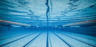 Underwater view of empty swimming pool lanes