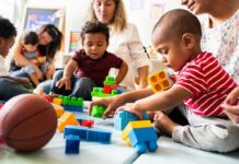 Hidden Autism Signs Parents Miss Karyn Polito with toddlers building blocks on a play mat