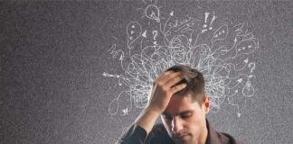 Man holding his head with chaotic doodles around his mind