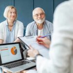 Smoking-Level Risk: The Epidemic Nobody Sees senior couple meeting with advisor at home