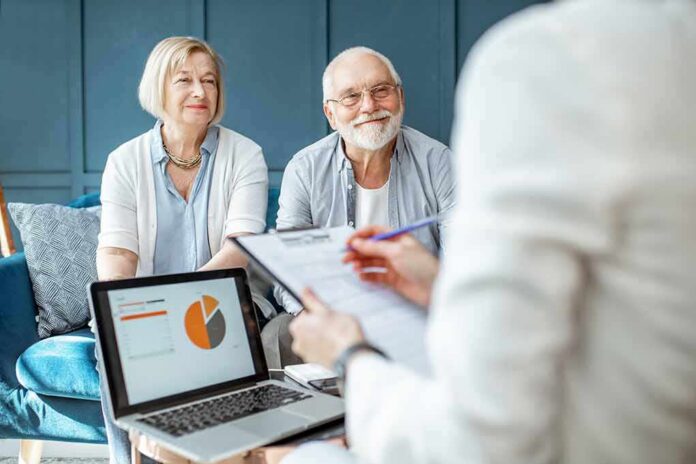 shutterstock_1362257816-1 senior couple meeting with advisor at home