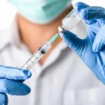 How to Get Rid of Stretch Marks, from a Dermatologist! Healthcare worker drawing vaccine from vial with syringe