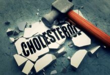 Sledgehammer smashing a tile labeled cholesterol