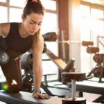 Common Strength-Training Mistakes to Avoid Woman performing dumbbell row in a gym