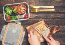 Lunchbox Plastic, Big Liver Harm Hands slicing cooked chicken on a wooden cutting board