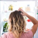 Boost Your Mitochondria With These Everyday Foods Person looking into an open refrigerator