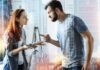 Passive Aggression Crumbles Under One Line Two adults arguing indoors, man pointing at woman holding a phone