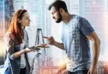Passive Aggression Crumbles Under One Line Two adults arguing indoors, man pointing at woman holding a phone
