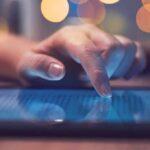 How To Spot Health Misinformation Online Hand tapping a tablet screen