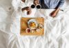 Breakfast Trick Slashes Bad Cholesterol Breakfast in bed with two people holding coffee