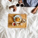 Breakfast Trick Slashes Bad Cholesterol Breakfast in bed with two people holding coffee