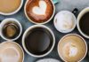 Assorted coffee cups arranged on a tabletop