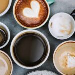 Calorie Bomb Hiding In Coffee Assorted coffee cups arranged on a tabletop