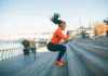 Scientists Spot Muscle ‘On’ Switch – No Pills Woman exercising on outdoor steps by a riverside
